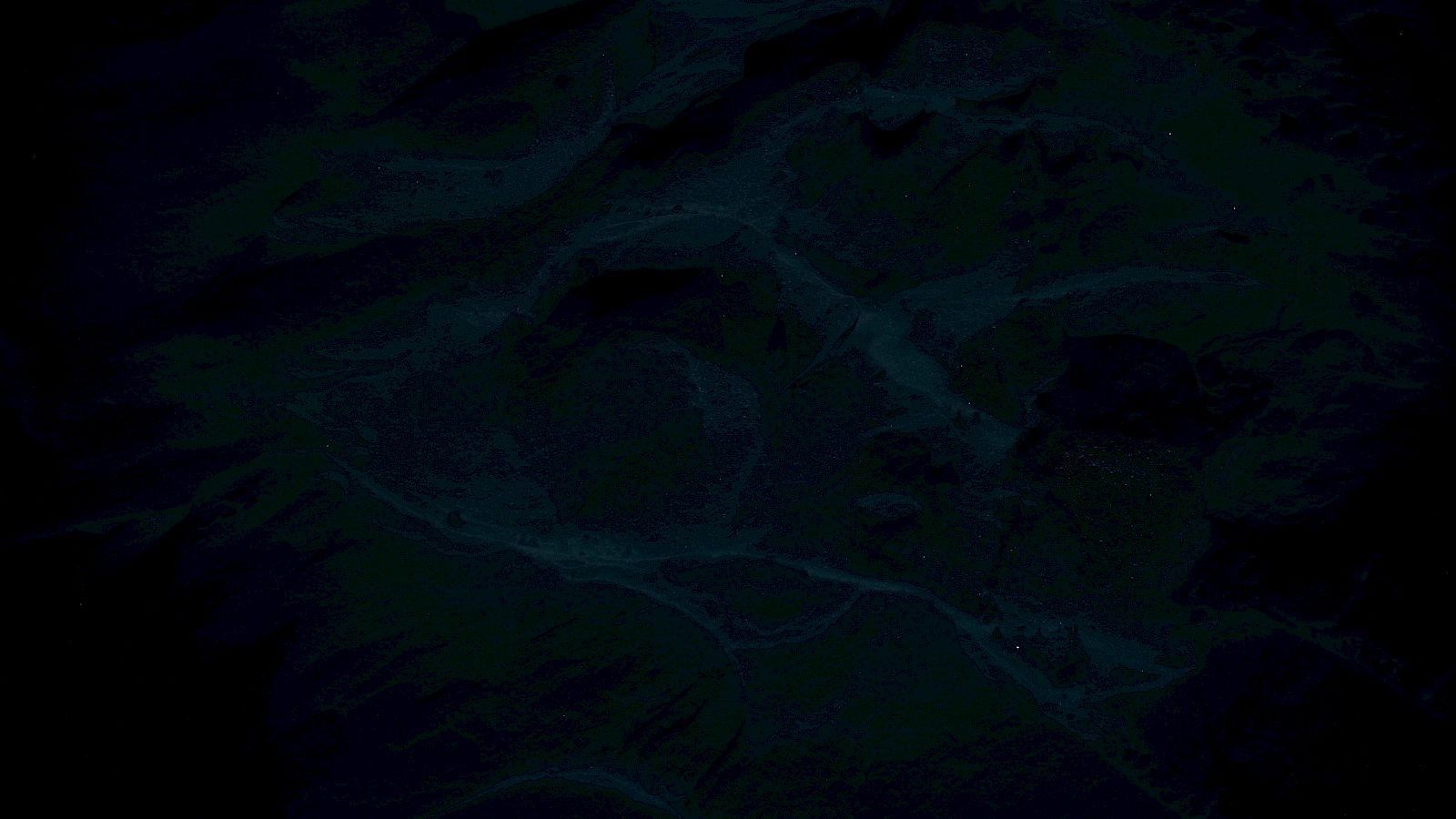 The image is very dark and unclear, obscuring any distinct features or objects within the scene.